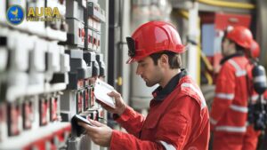 Aura Fire Safety technician performing an annual fire alarm inspection